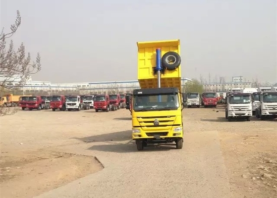 el camión volquete resistente de 8×4 371HP 32 toneladas carga el color amarillo rojo blanco de la caja de la descarga 30CBM
