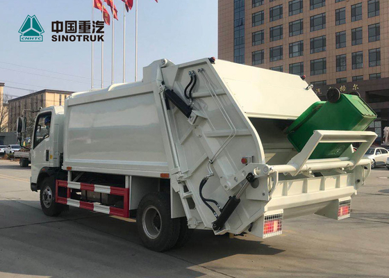 Euro del camión de basura del acuerdo de Sinotruk Howo 4x2 3 120hp 9cbm sin el durmiente